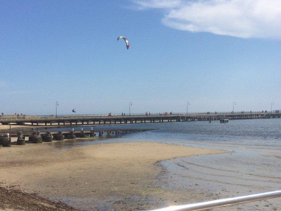 Australia - Fitzroy - Jumping kite surfer at St. Kilda beach. 