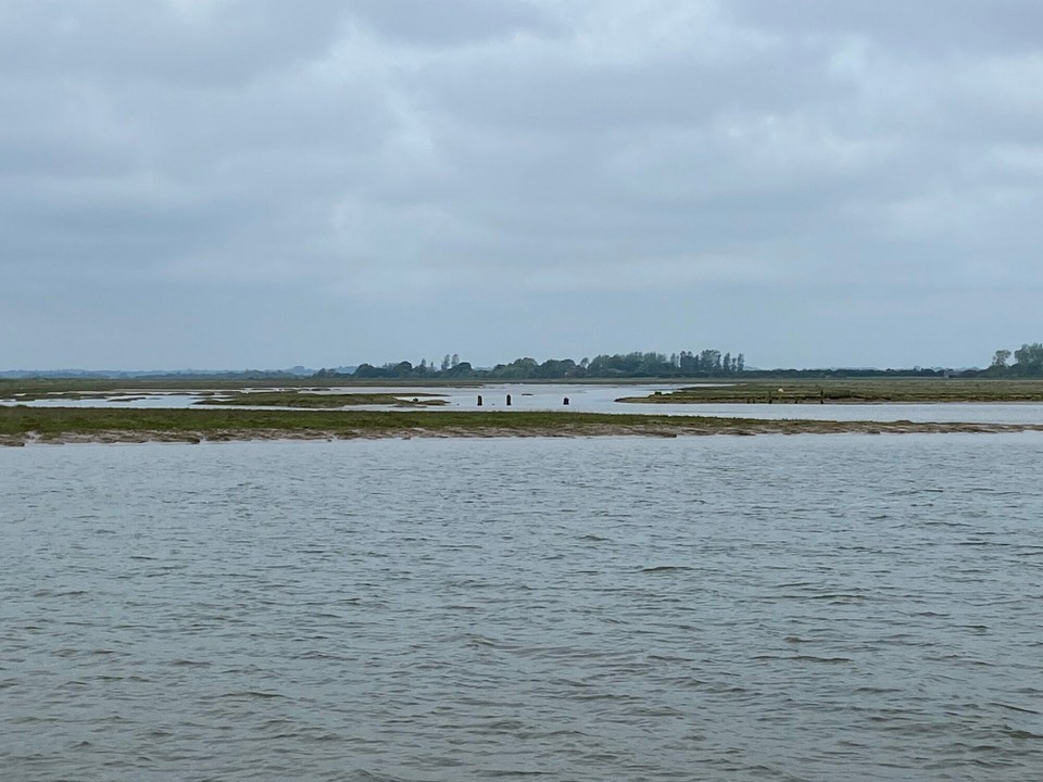 United Kingdom - Walton On The Naze - Having successfully picked up our first mooring buoy of the season, Kevin sat in the dinghy and scraped the weed from the waterline on the hull, and yet more cleaning!