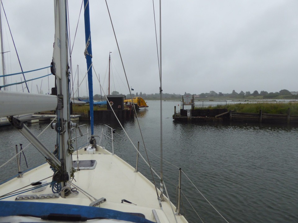 United Kingdom - Chelmsford - Leaving Walton Yacht Basin at high tide on a grey, mizzly day.