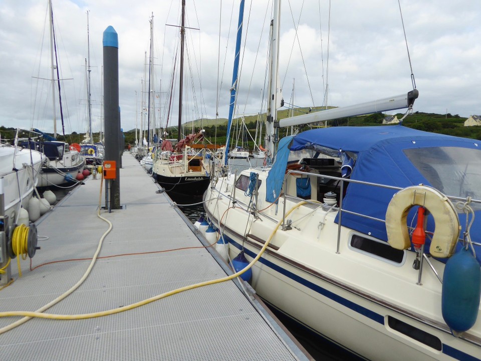 Ireland - Bere Island - Because it’s such a small marina, every time someone leaves, everyone else moves along to make room for newcomers. Londubh (blackbird), the boat in front of us, was was built over eight years by her owner, and launched in 2018.