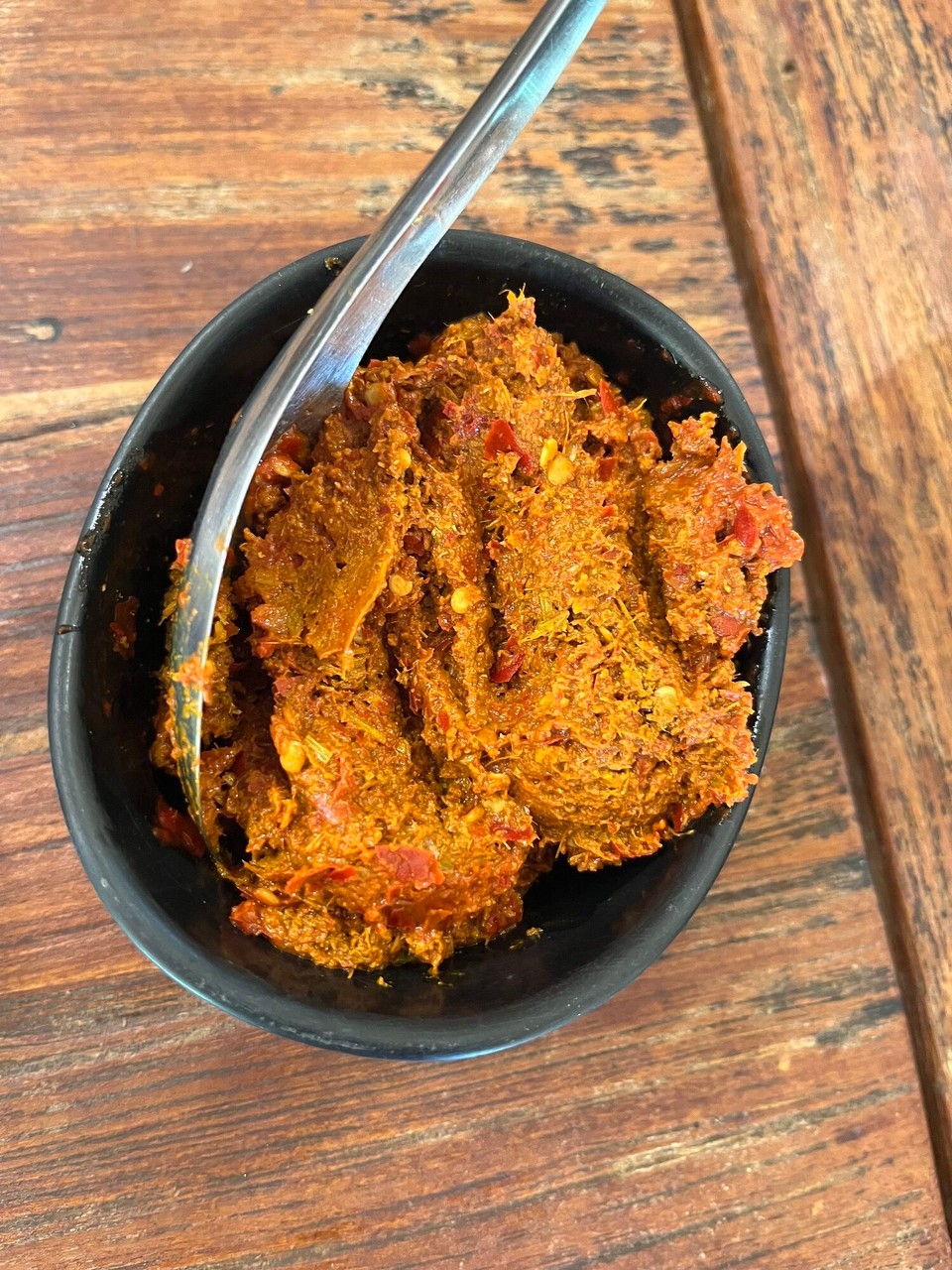 Thailand - Mueang Chiang Mai - Koh soi curry paste - I learnt that the curry paste goes into the wok first and smoothed around before then adding the chicken and the rest of the ingredients - this gives the whole dish more flavour 