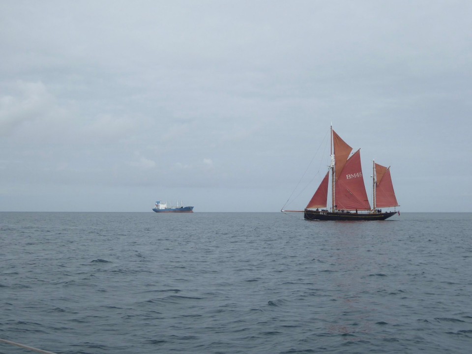 United Kingdom - Falmouth - New container ship contrasting with old trawler. 