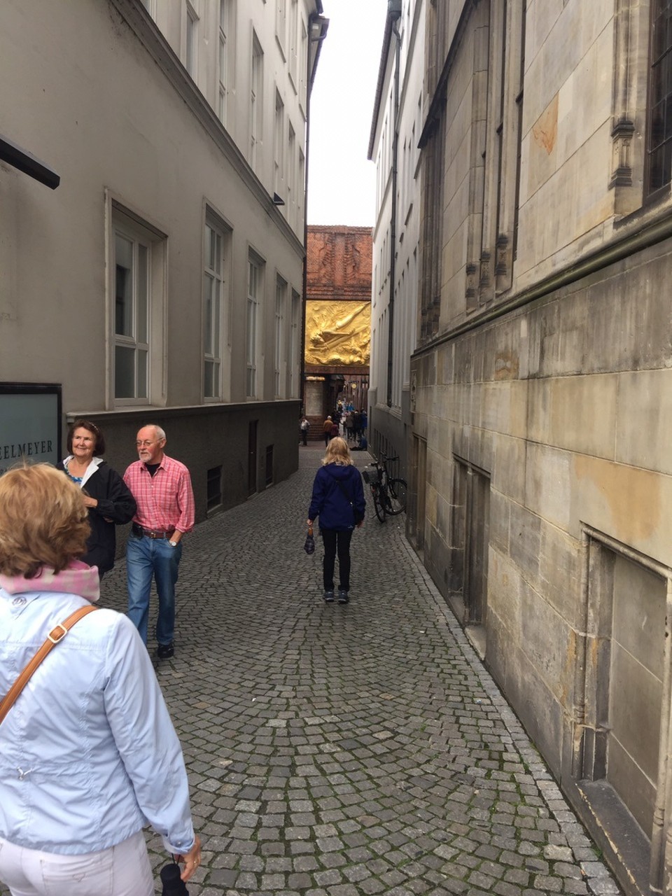  - Germany, Bremen - Bottcherstrasse. The gilt relief called "Bringer of Light" adorns the gateway and is home to the Paula Modersohn-Becker Museum, the Roselius-Haus and the carillon made from Meissen porcelain. 