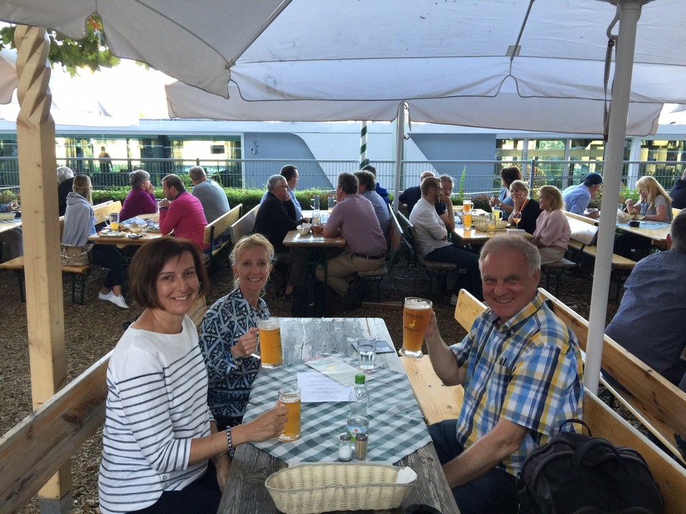  - Germany, Würzburg - Drinking beer from the local brewery at the Goldene Ganz by the loch on the River Main. 