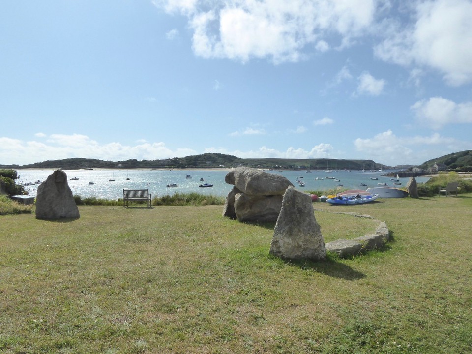 United Kingdom - Isles Of Scilly - A modern megalithic folly, with a kerbed quoit (mini-Chun) and several standing stones, overlooks New Grimsby harbour.