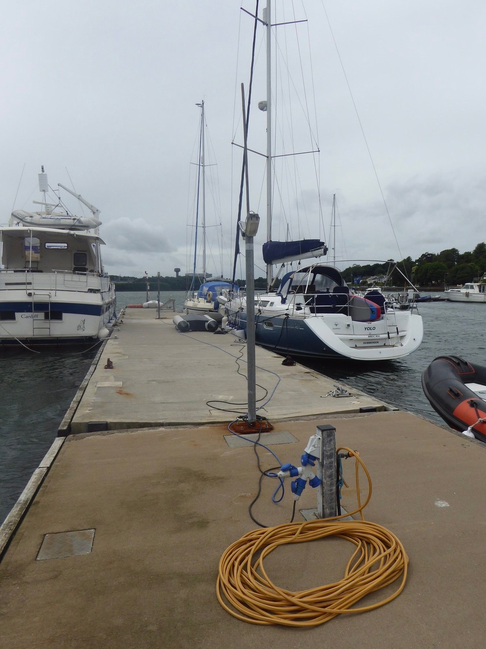 Ireland - Cork - Despite not looking it, the solid pontoon is good protection during the gale force winds we’ve been experiencing (this is the Fastnet weather area). Note the coiled hose; Kevin is OCD about putting it away properly, but it never stays that way for long and he always finds it in a tangled mess.