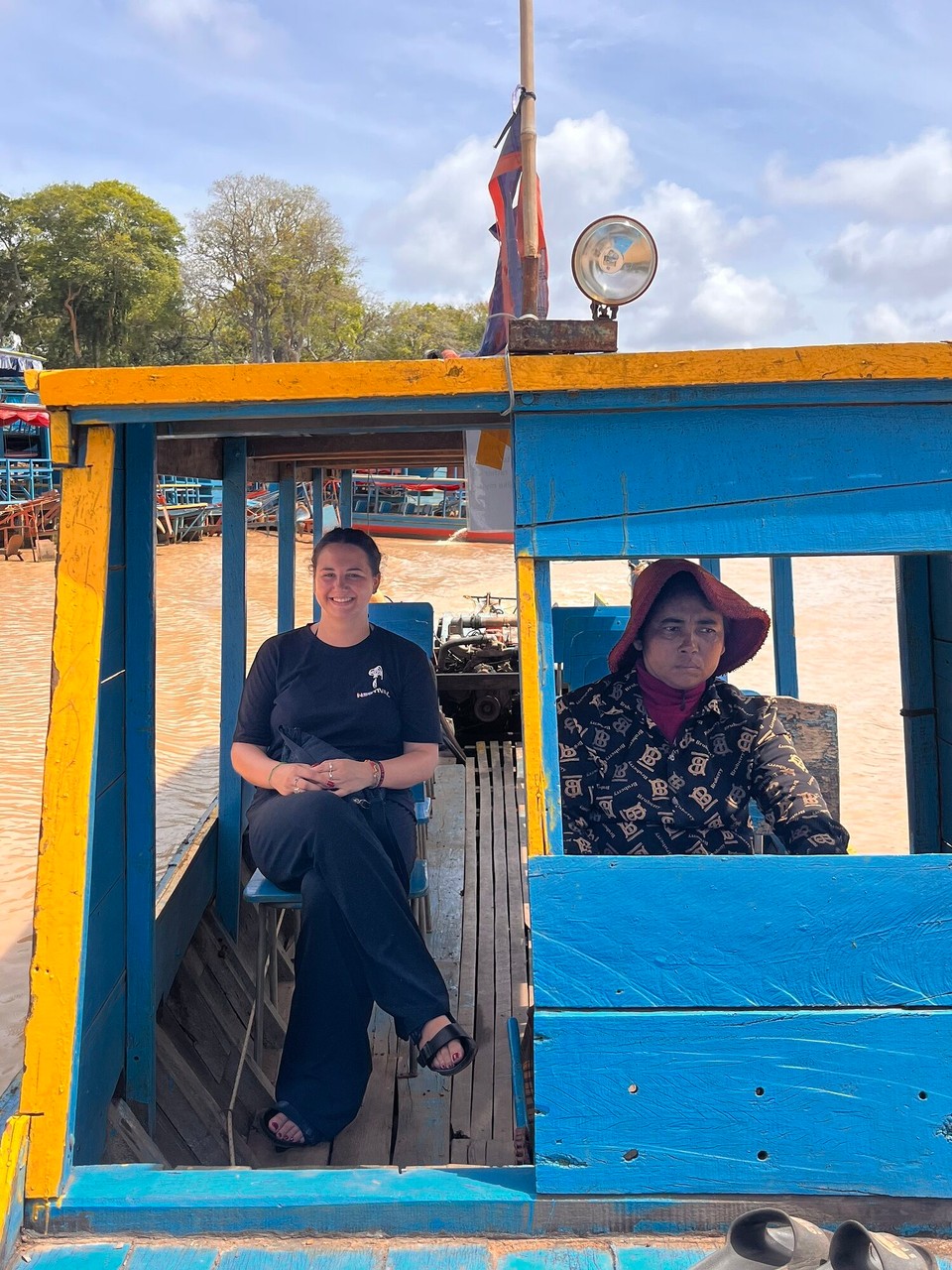 Cambodia - Siem Reap - Being driven around some of the places which are already floating. This lady was actually really friendly despite her face here 